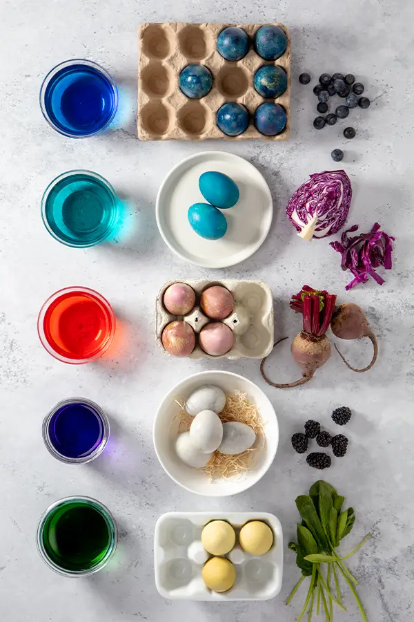 Dyed eggs next to produce of the same color