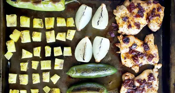 Pineapple Chipotle Chicken Tacos ingredients on a sheet pan