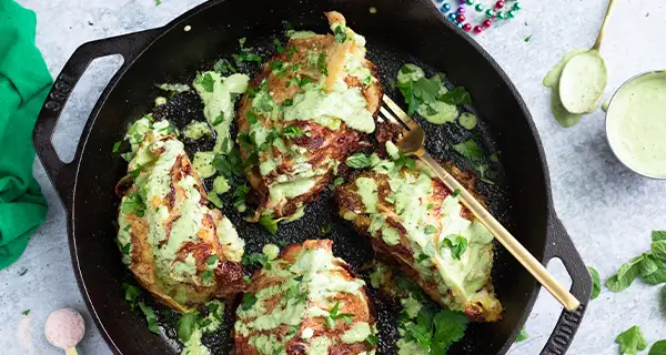 roasted green cabbage with tahini sauce in a pan