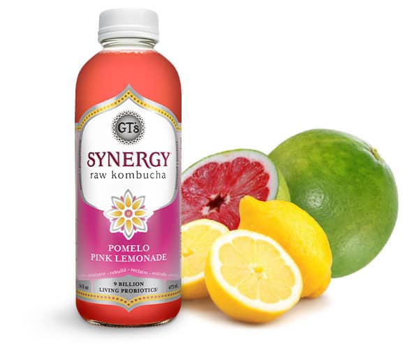 GT's synergy Pomelo Pink Lemonade flavor next to fruit